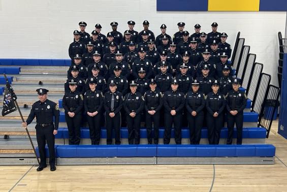 Local Police Officers Pose for Graduation Picture 